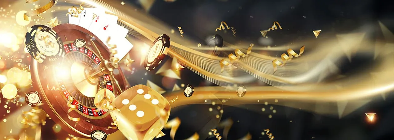 Gold roulette wheel, playing cards and casino chips
